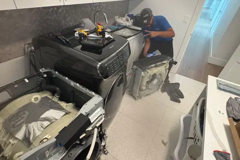 Technician beside a Samsung FlexWash during a lid replacement in Miami